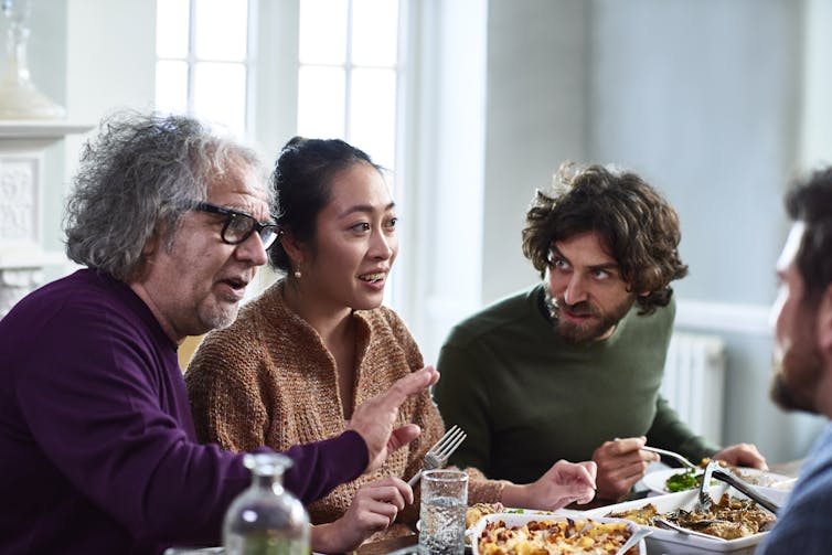 animated people talking over a meal