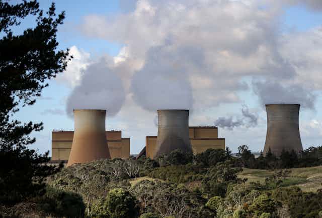 steam billows from coal chimneys