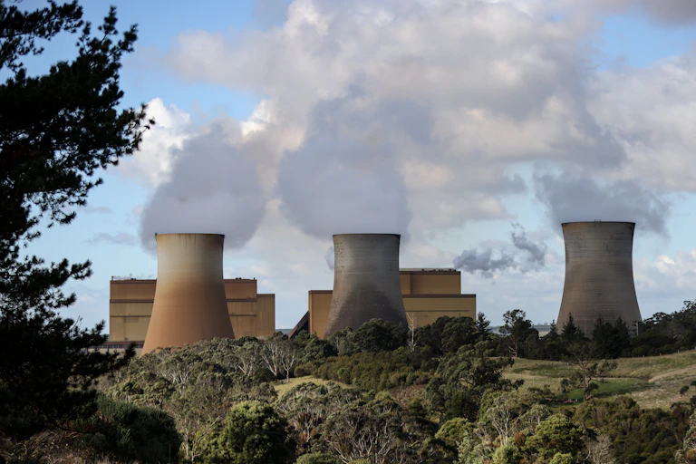steam billows from coal chimneys
