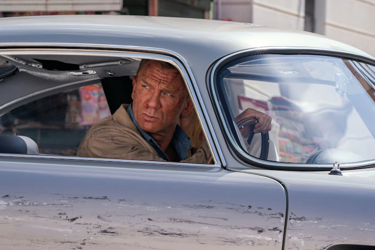 James Bond (Daniel Craig) behind the wheel of an Aston Martin in 'Death Can Wait'.