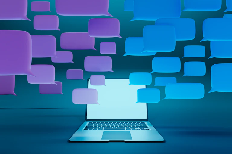 Purple and blue thought bubbles hover around an open laptop whose screen is illuminated light sky blue.