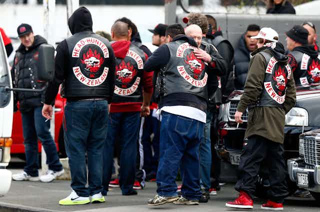 Head Hunters gang members with patches showing