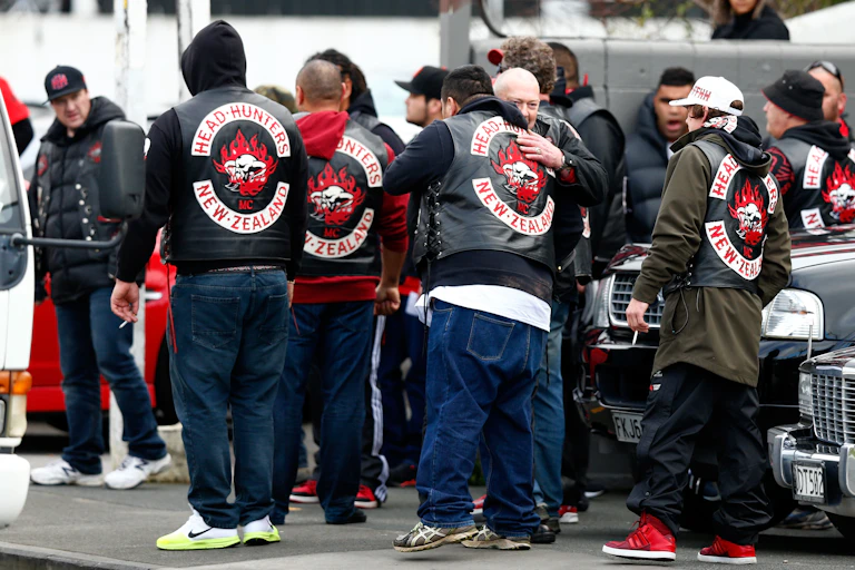 Head Hunters gang members with patches showing
