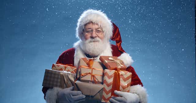 Santa Claus holding presents 