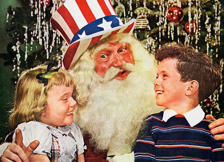 Painting of Santa Clause wearing a stars-and-stripes hat as a young boy and girl sit on his lap.