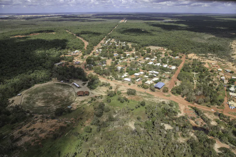 An aerial view of a small remote tropical community