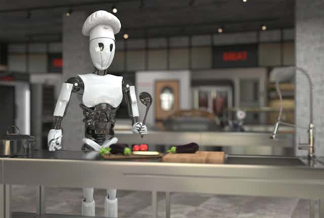 A robot wearing a chef hat stands in front of a stainless-steel counter holding a ladle.