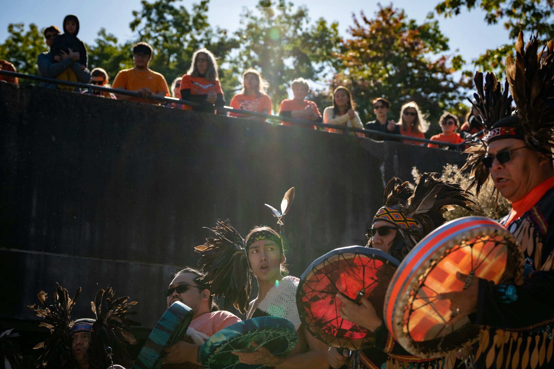 People seen listening in a crowd.