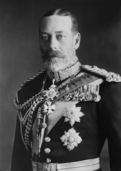 A black and white photograph of King George V in full dress uniform.