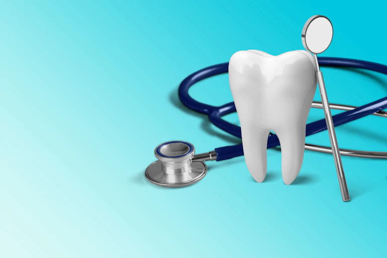 A tooth, a dental mirror and a stethoscope against a white background