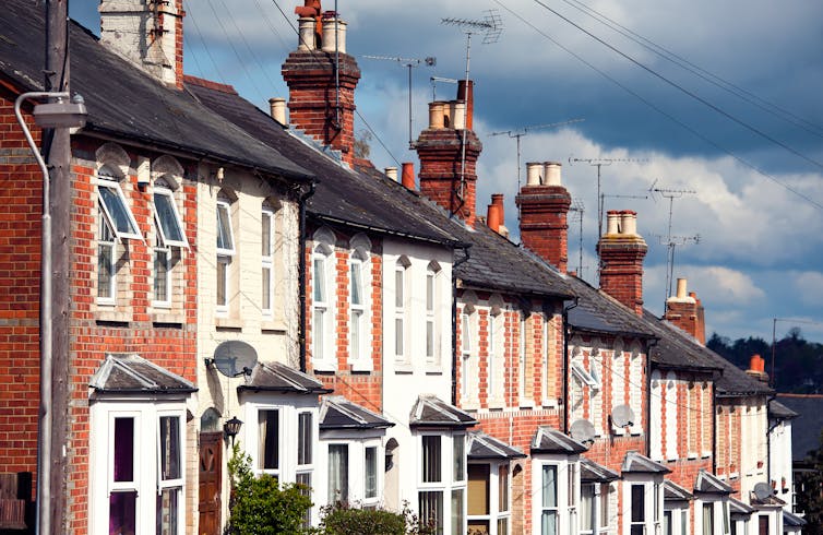 Row of terraced houses, going downhill.