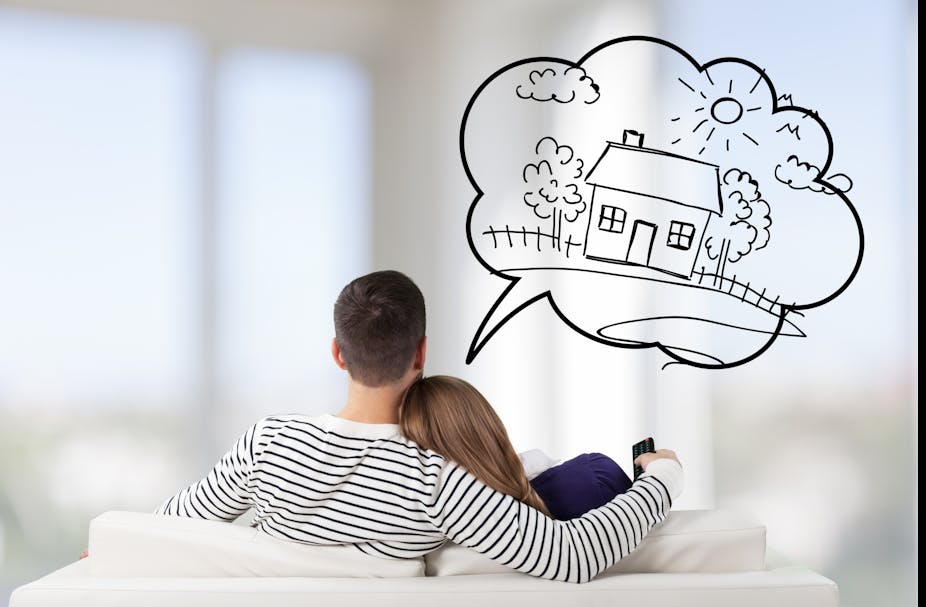 Couple sitting on sofa (from behind), with speech bubble with house drawn inside it.