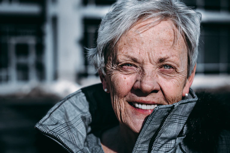 An elderly woman smiling
