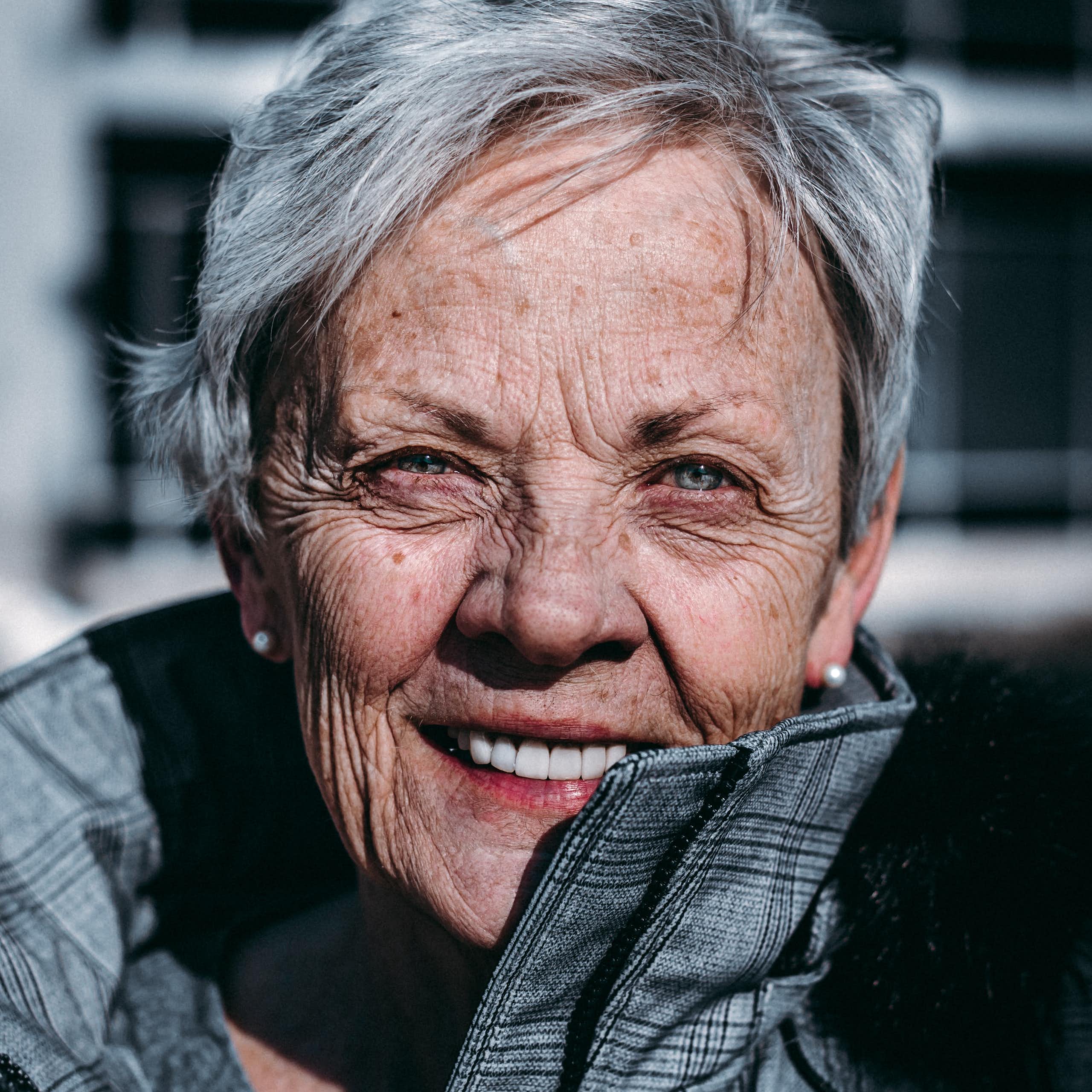An elderly woman smiling