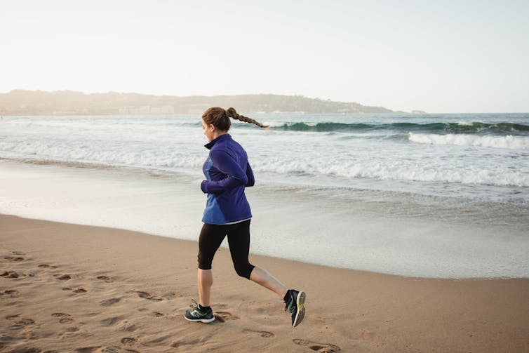 woman running on beach