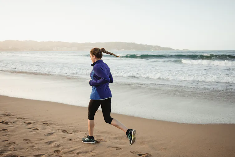 woman running on beach
