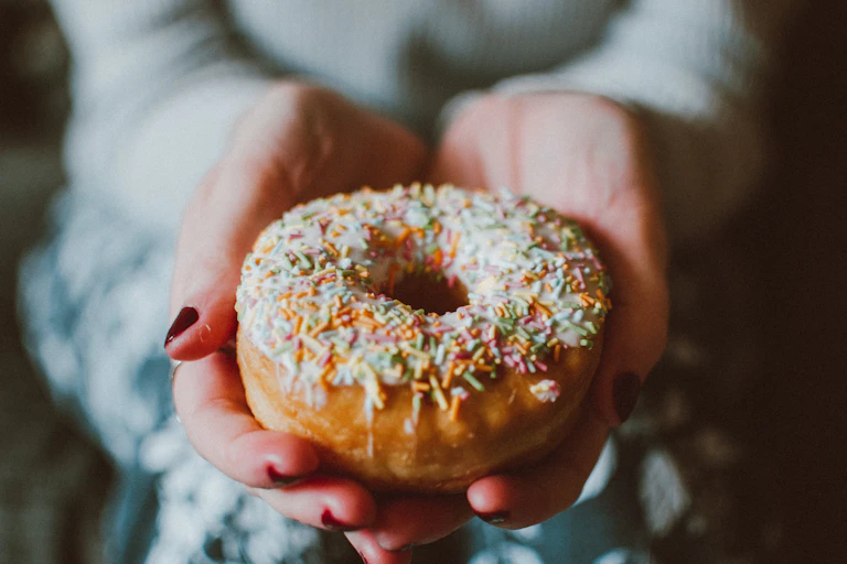 Woman holds donut