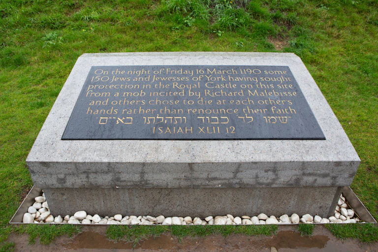 A plaque on a stone memorial.