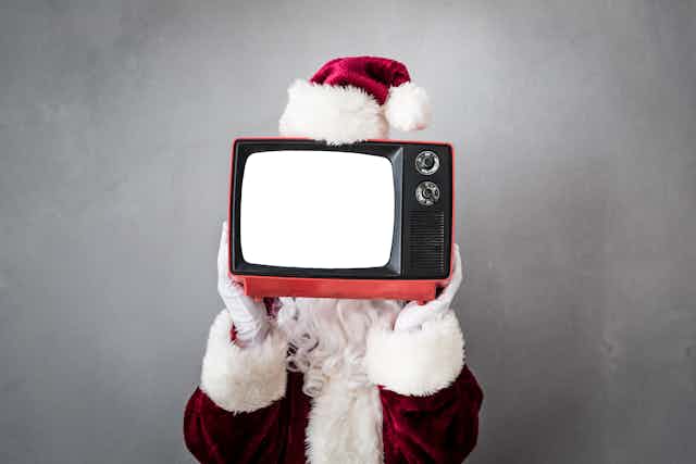 Un Papá Noel que en vez de cara tiene un televisor.