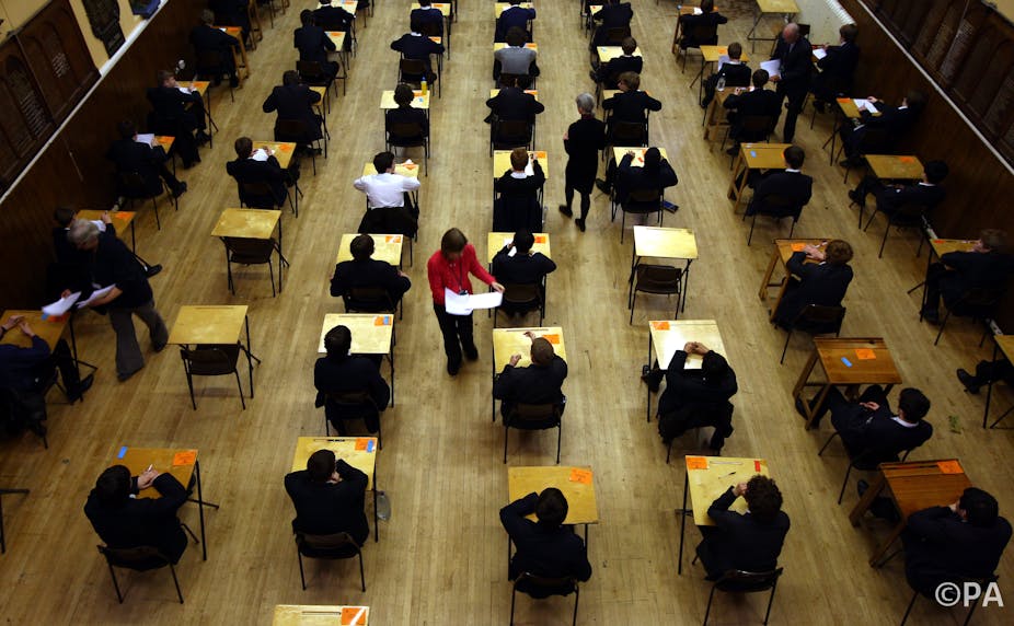 What is the reason for the increase in the number of students getting A  grades in their GCSEs in the UK? Is it because the exams are easier now, or  because more