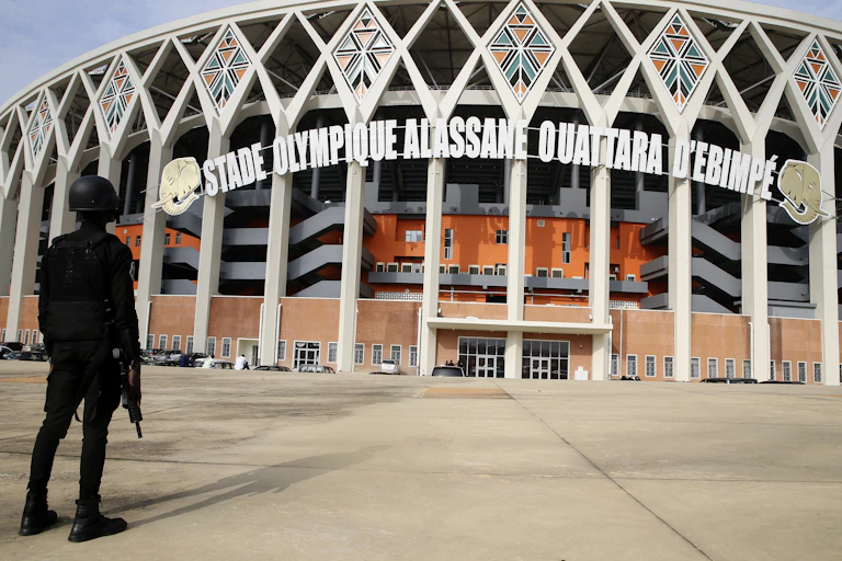 A guard in front of the Alassane Ouattara Stadium.