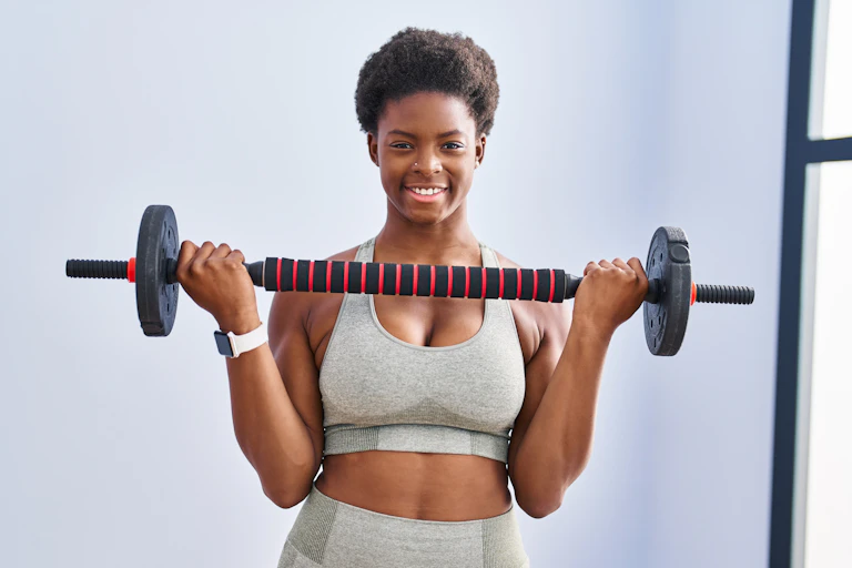 A woman holding a barbell