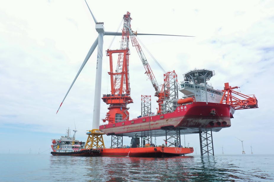 Large offshore wind turbine and cranes and construction boats
