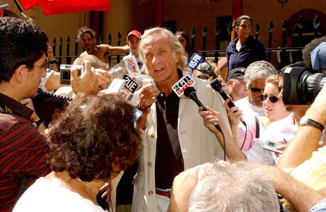 Journalist John Pilger speaks at a rally in Sydney.