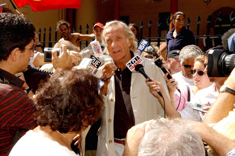 Journalist John Pilger speaks at a rally in Sydney.