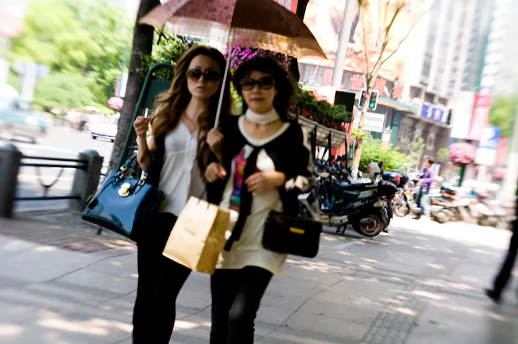 Two women shopping in Shanghai.