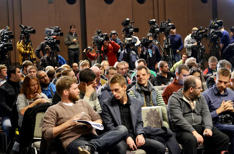 Reporters and photographers at a press conference, Kyiv 2015.