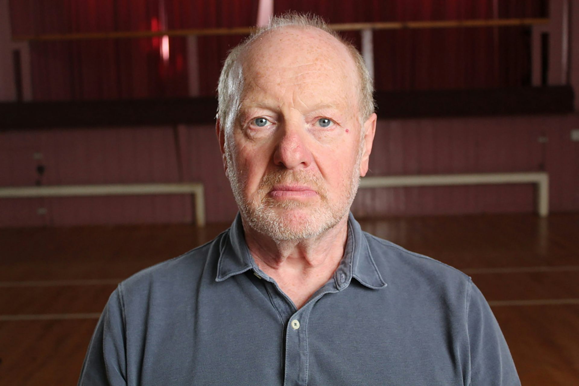 Portait photo of a middle aged man.