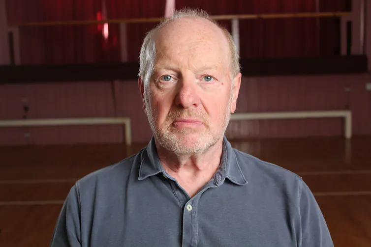 Portait photo of a middle aged man.