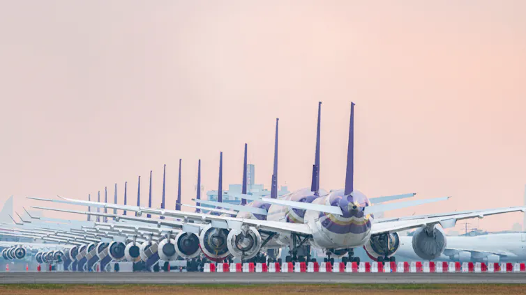 Line of planes on runway.