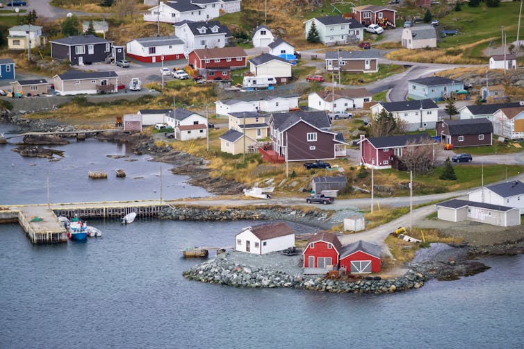 Aerial view of a rural town situated on a rocky coast