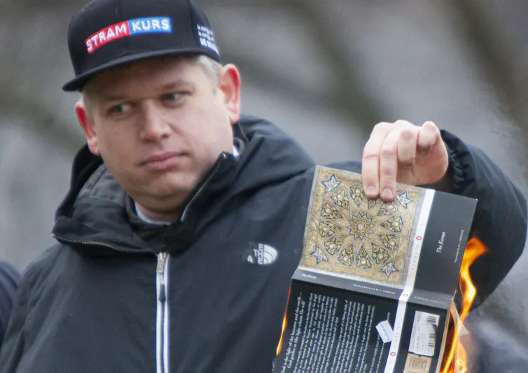 Danish-Swedish extremist and politician Rasmus Paludan as he burns a Quran in front of the Turkish embassy in Stockholm on January 21, 2023 (Photo: Tobias Hellsten/Wikipedia)