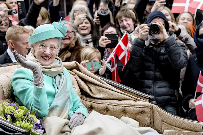 Queen Margrethe with a smile and a wave