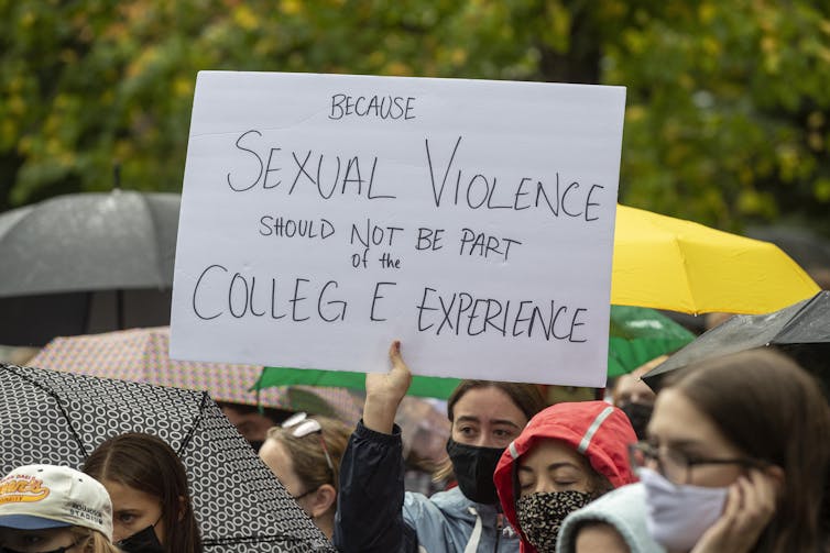 A sign at a protest that reads: sexual violence should not be part of the college experience