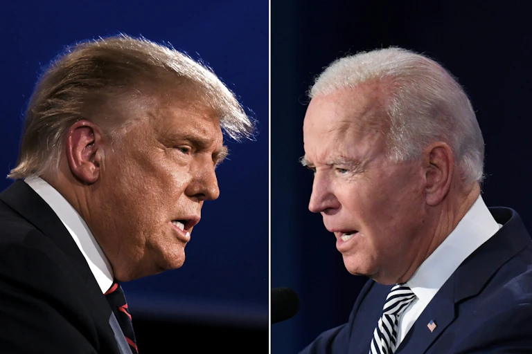 Headshots of two men, both wearing dark suits and ties, facing each other