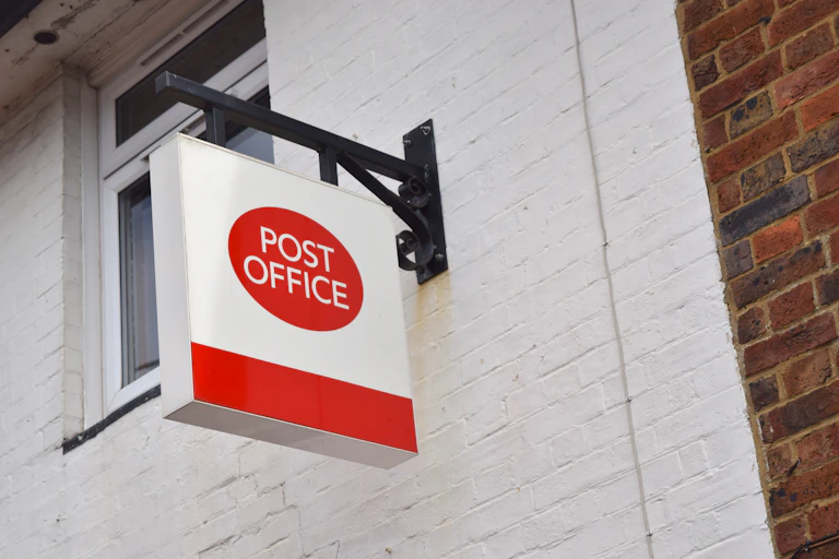 A sign outside a post office branch.