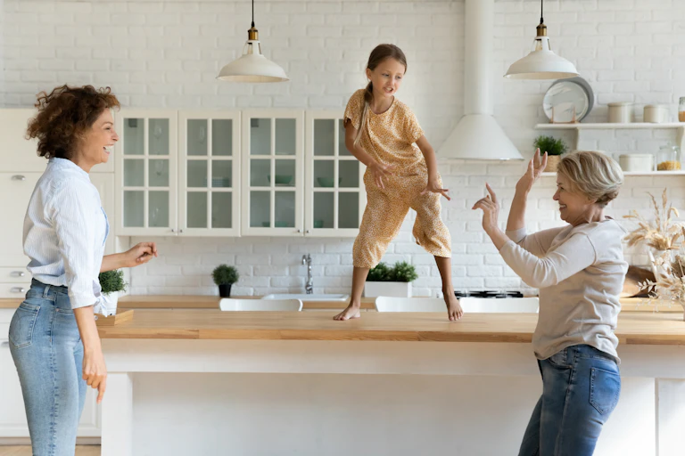 three generations of women dancing together