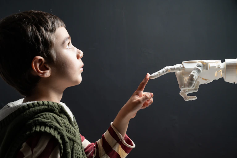 Child touches finger of humanoid robot