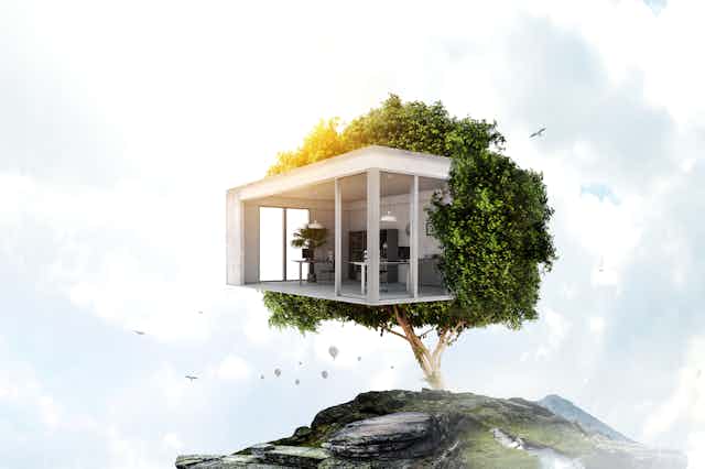 Eco-house concept illutration showing a modular house within a tree on top of a mountain