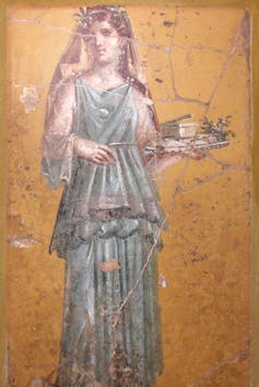 Fresco de una mujer llevando una bandeja en Villa San Marco en Stabiae (Italia).