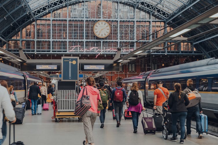 A crowded platform for Eurostar at St. Pancras station in London, UK.