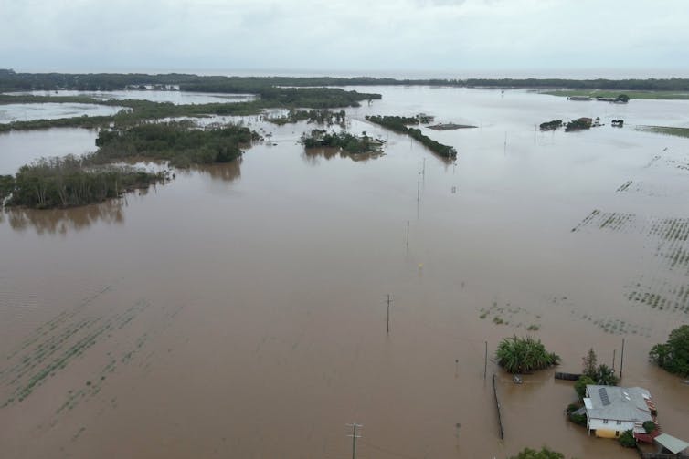 A drone shot of large swaths of land under flood waters