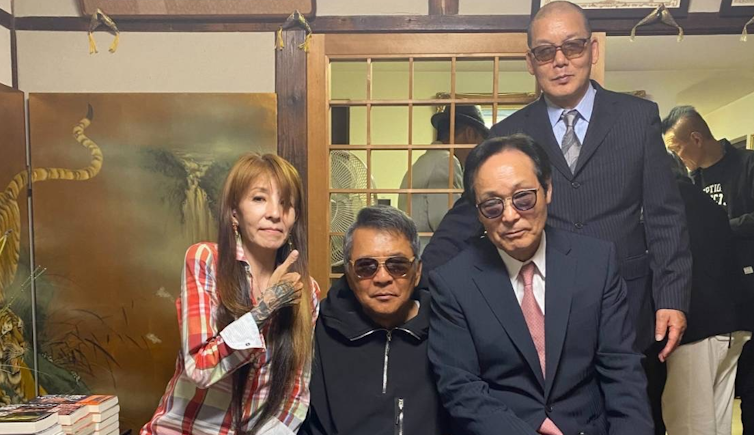 A group of middle-aged former yakuza members