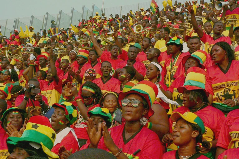 Men and women wearing colourful attire