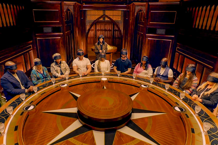 The Traitors being picked around the round table.