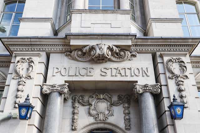 An ornate entrance to a police station in England.